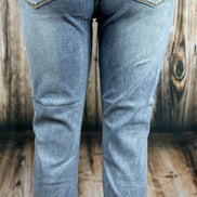 Light blue Judy Blue Boyfriend jeans displayed folded with visible stitching and relaxed fit, showcasing casual denim style.