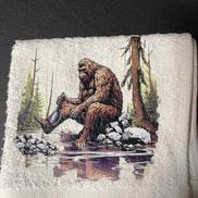 Squatchin’ Country Bathing Bigfoot 3-piece towel set with playful Bigfoot design, including bath towel, hand towel, and washcloth.