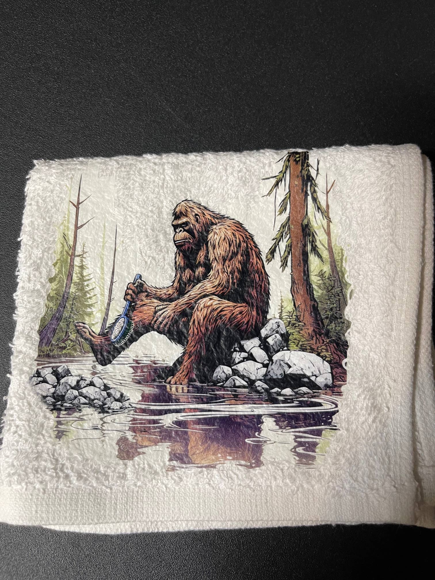 Squatchin’ Country Bathing Bigfoot 3-piece towel set with playful Bigfoot design, including bath towel, hand towel, and washcloth.