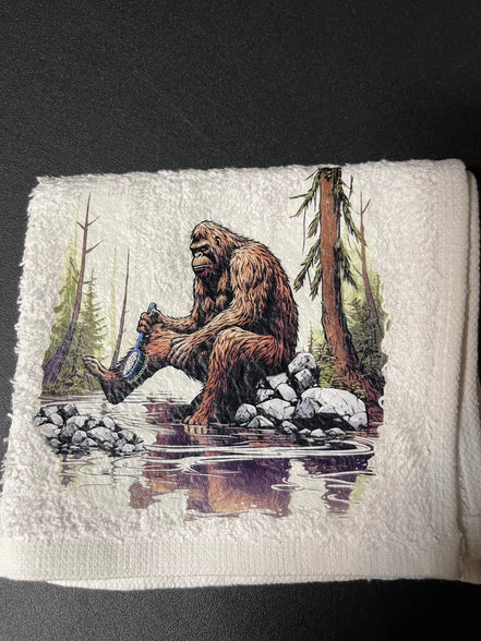 Squatchin’ Country Bathing Bigfoot 3-piece towel set with playful Bigfoot design, including bath towel, hand towel, and washcloth.
