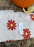Relaxed fit boucle fabric floral knit cropped sweater is adorned w/ red and yellow flowers. Crew neck & long sleeves.