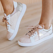 Colorful patchwork sneakers by Liam & Company featuring mixed fabric patterns and casual shoe design.