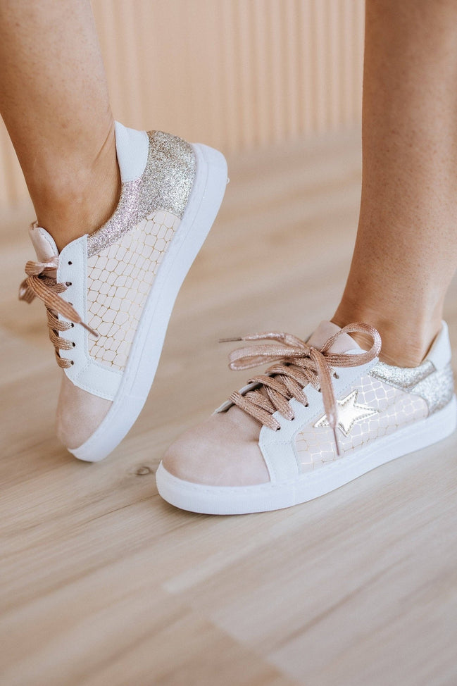 Colorful patchwork sneakers by Liam & Company featuring mixed fabric patterns and casual shoe design.