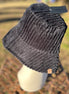 Fashion City corduroy bucket hat with wide brim and stitched detail, stylish accessory for casual and outdoor wear.