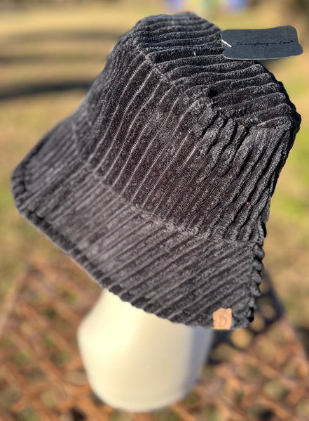 Fashion City corduroy bucket hat with wide brim and stitched detail, stylish accessory for casual and outdoor wear.