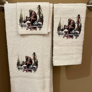 Set of three plush bath towels featuring Bigfoot design from Squatchin’ Country, perfect for a fun and cozy bathroom experience.