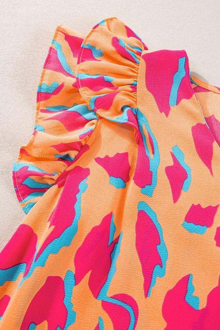 Abstract V-neck blouse with ruffled sleeves from Little Daisy Closet, showcasing a stylish top with a flowy, feminine design.