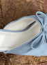 Light blue double bow peep hole sandal with low heel and slip-on design. Vegan leather with DreamCloud cushion.