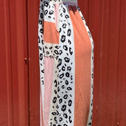 Vanilla Monkey. Tie shoulders with smocked bodice. Salmon and leopard color block. S, M $40