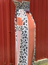 Vanilla Monkey. Tie shoulders with smocked bodice. Salmon and leopard color block. S, M $40