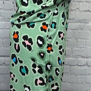 Aapparella leopard print shirt and wide-leg pants showcasing trendy animal print fashion ensemble.