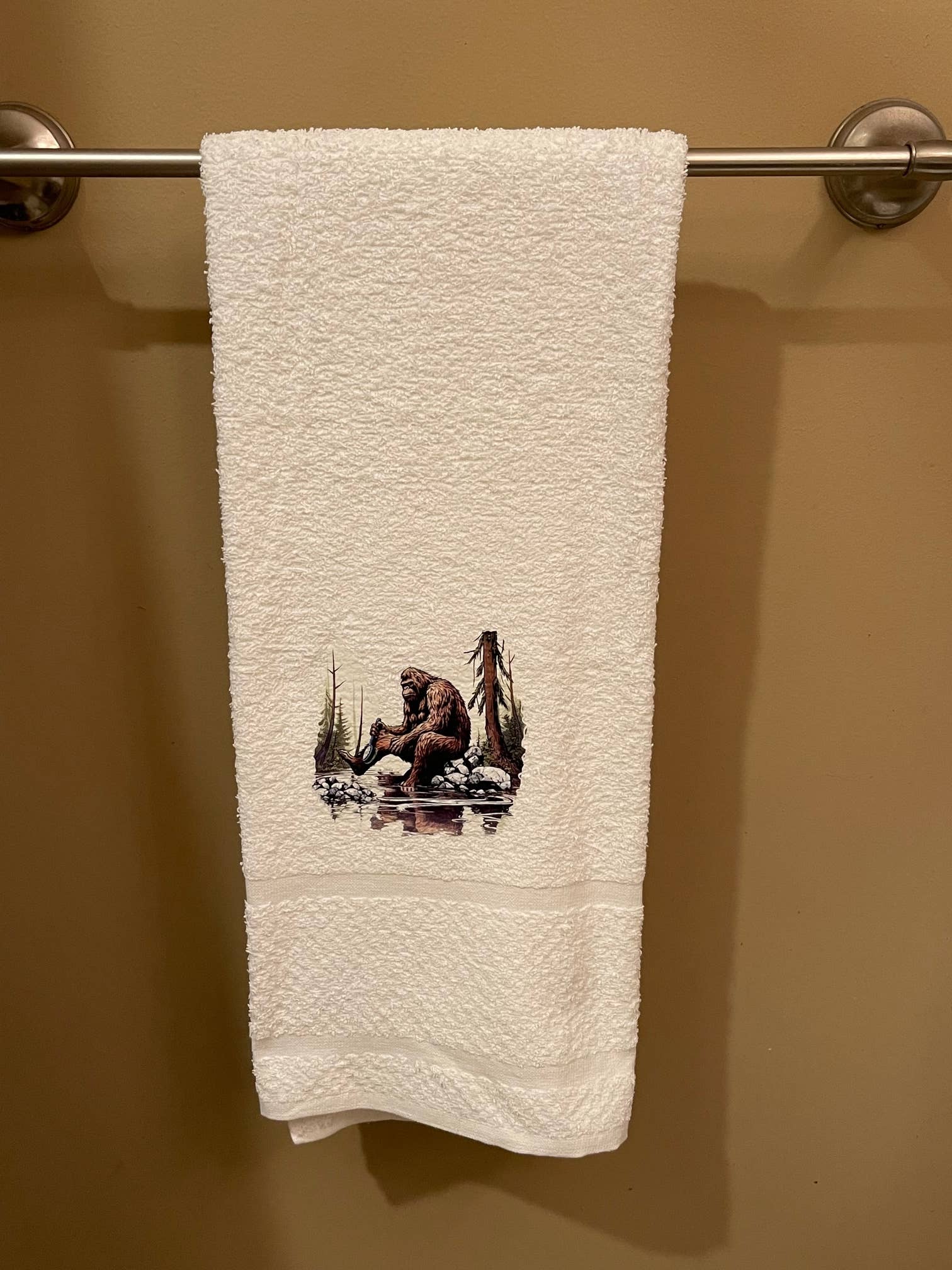 Squatchin’ Country Bathing Bigfoot 3-piece towel set with nature-inspired designs, including bath towels and hand towels.