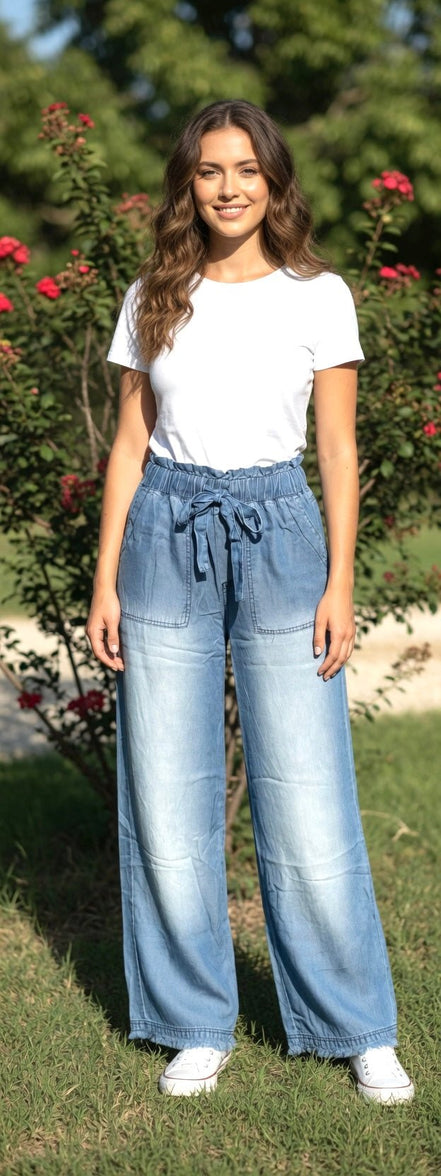 Light blue chambray pants from 42POPS with a relaxed fit, featuring a paper bag waist and front pockets.