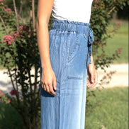 Light blue chambray pants from 42POPS with a relaxed fit, featuring a paper bag waist and front pockets pockets.