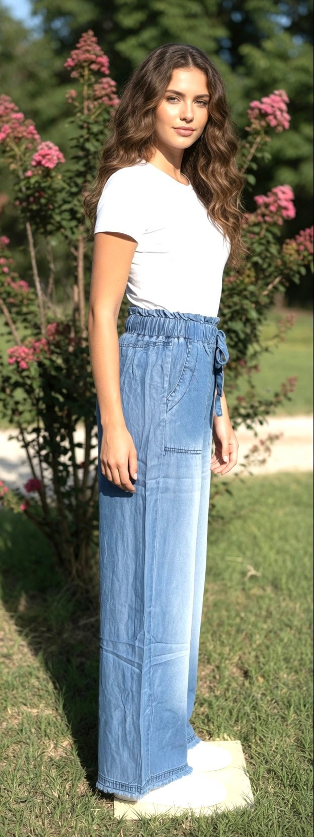 Light blue chambray pants from 42POPS with a relaxed fit, featuring a paper bag waist and front pockets pockets.