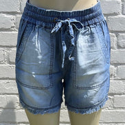 Blue chambray shorts by 42POPS, featuring a casual fit with frayed hems and pockets for a relaxed summer look.