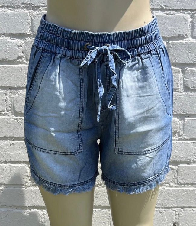 Blue chambray shorts by 42POPS, featuring a casual fit with frayed hems and pockets for a relaxed summer look.