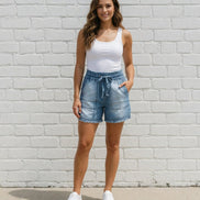 Light blue chambray shorts from 42POPS featuring a relaxed fit and frayed hems, perfect for casual summer wear.