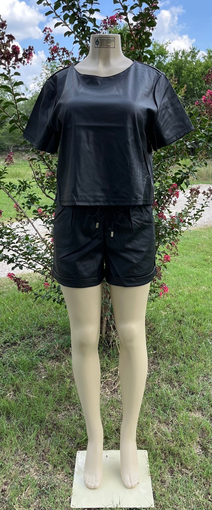 Vegan leather short set by 42POPS featuring a fitted top and matching high-waisted shorts for a stylish casual look.