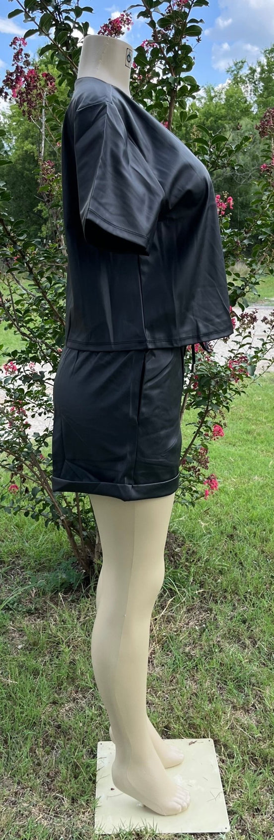 Vegan leather short set by 42POPS featuring a stylish, fitted top and matching shorts for a trendy, eco-friendly look.