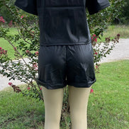 Vegan leather short set by 42POPS featuring a fitted top and matching high-waisted shorts for a trendy, stylish look.