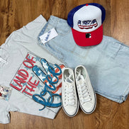 Southern Attitude Designs Inc. brand. Light concrete gray Bella Canvas tee w/ red, white and blue colors and peace sign flag.