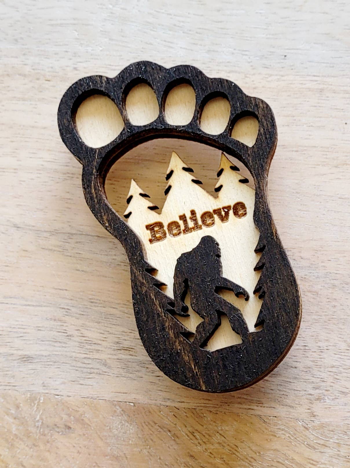 Big Foot magnet featuring a detailed, humorous Big Foot design, perfect for displaying on refrigerators or metal surfaces.