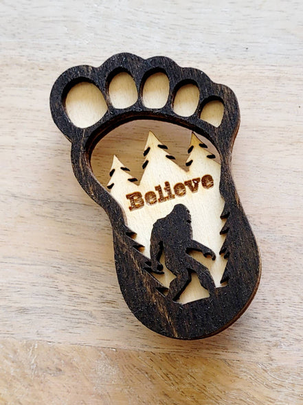 Big Foot magnet featuring a detailed, humorous Big Foot design, perfect for displaying on refrigerators or metal surfaces.