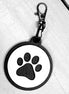 Dog paw keychain from The Country Roost featuring a detailed paw print design on a metal keyring.