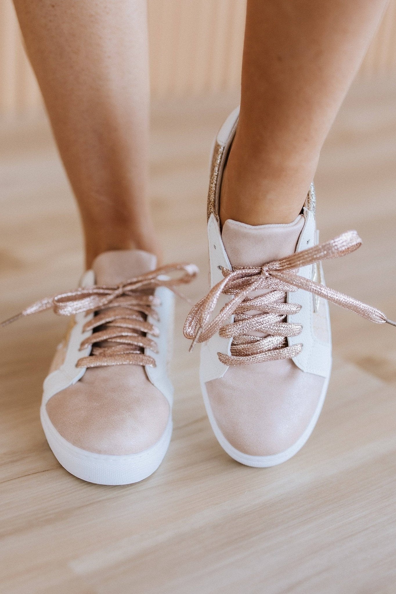 Colorful patchwork sneakers by Liam & Company featuring mixed fabric panels and casual lace-up design.