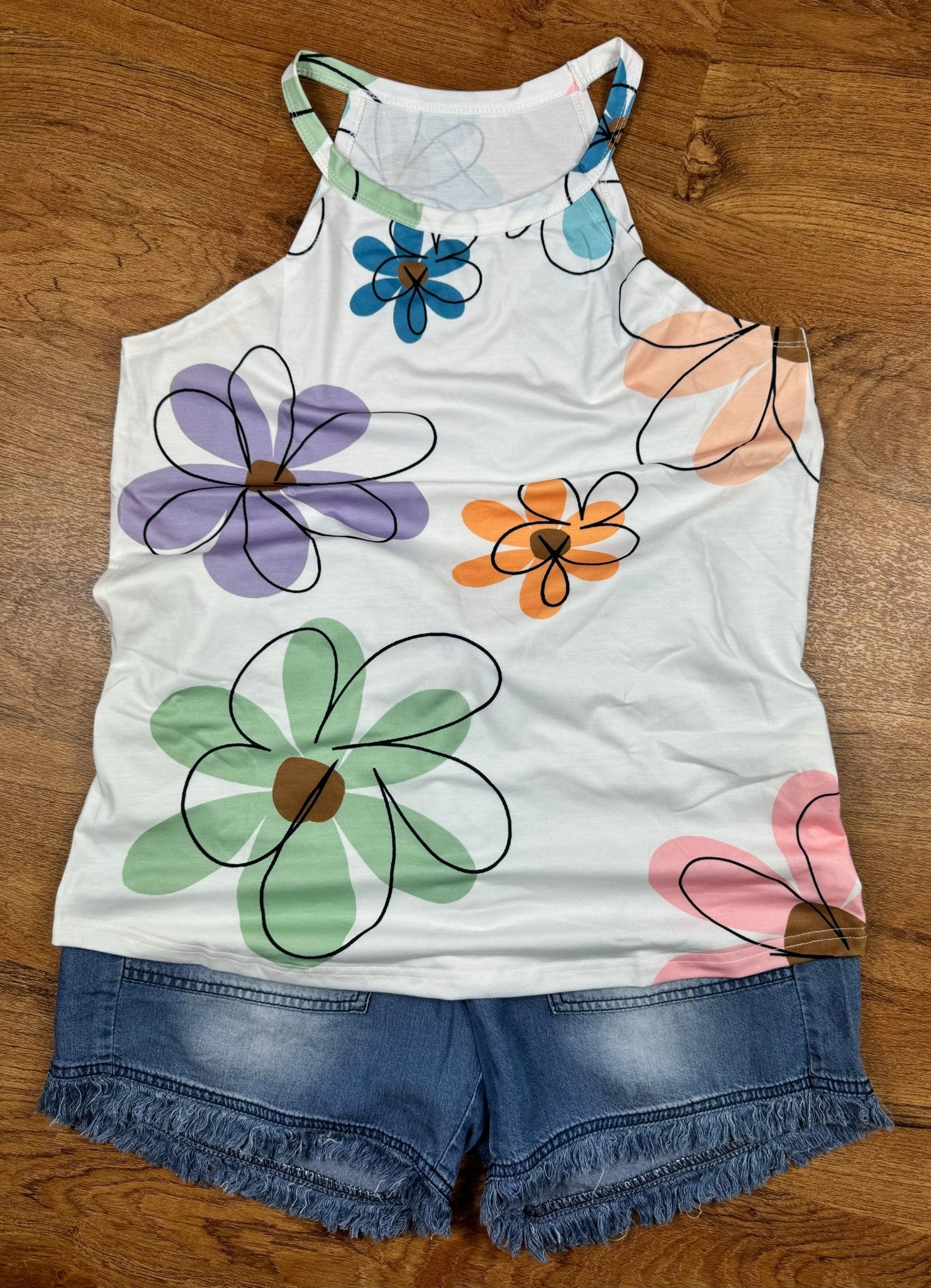 Aapparella big floral print sleeveless tank top with vibrant flower patterns and comfortable fit, perfect for casual wear.