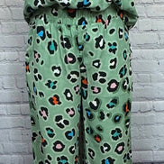 Leopard print shirt and wide-leg pants set by Aapparella, featuring stylish animal print fabric and relaxed fit.