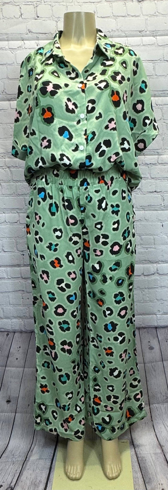 Leopard print shirt and wide-leg pants set by Aapparella, featuring stylish animal print fabric and relaxed fit.