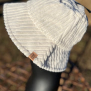 Fashion City corduroy bucket hat showing a wide brim and textured fabric in a casual style.