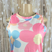 Big pink floral print tank top by Aapparella with vibrant flower patterns and lightweight fabric for a stylish summer look.