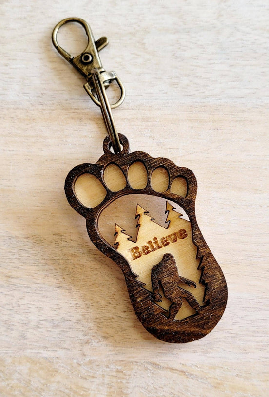 Big Foot keychain with detailed Sasquatch figure, attached to a metal keyring, from The Country Roost.