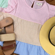 Shopin LA brand. Striped color blocked sundress with side pockets. Ruffle detail. White, pink, yellow/orange, blue and green.