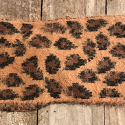 Pretty Simple leopard twist headband with black and tan leopard print, stylish accessory for hair and fashion.