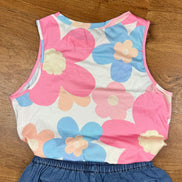 Pink floral print tank top by Aapparella, featuring a sleeveless design and vibrant flower pattern on lightweight fabric.