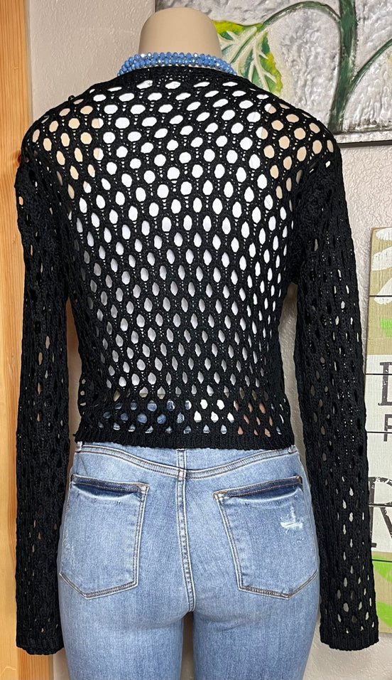 ADORA LA brand. This front tie crocheted cardigan is available in black or cream. Randomly sewn multicolored granny squares.