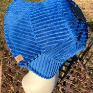 Fashion City corduroy bucket hat showing a soft, textured beige fabric with a wide brim and casual style.