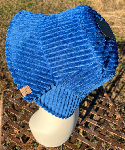 Fashion City corduroy bucket hat showing a soft, textured beige fabric with a wide brim and casual style.