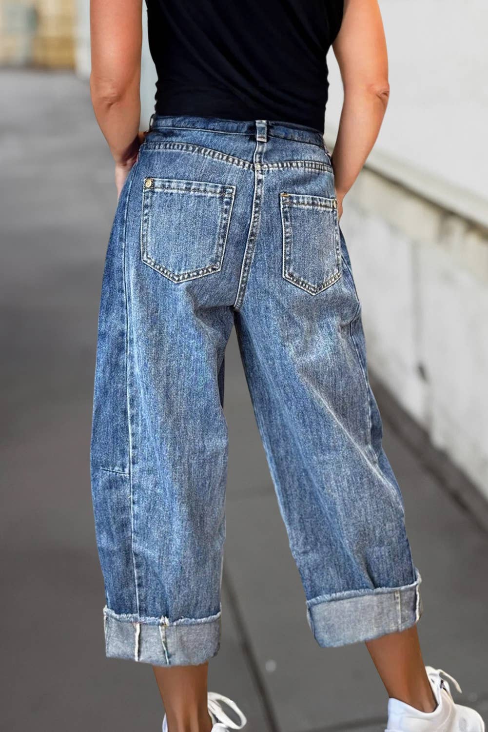 A pair of stitched raw hem wide-leg loose jeans from Aapparella featuring a relaxed fit and casual style.