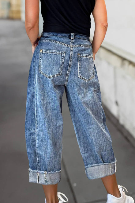 A pair of stitched raw hem wide-leg loose jeans from Aapparella featuring a relaxed fit and casual style.