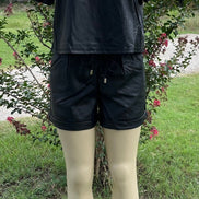 42POPS brand. Vegan leather short set. Rounded neck top w/ short sleeves and drawstring, elastic waist, cuffed bottom shorts.