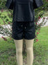 42POPS brand. Vegan leather short set. Rounded neck top w/ short sleeves and drawstring, elastic waist, cuffed bottom shorts.