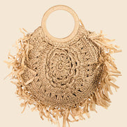 Straw braided fringe bag by Anarchy Street featuring woven design and fringed accents for a boho-chic look.