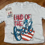 Southern Attitude Designs Inc. brand. Light concrete gray Bella Canvas tee w/ red, white and blue colors and peace sign flag.