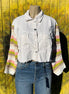 Bellissima Fashion denim patchwork jacket featuring colorful sewn patches and classic denim fabric, stylish and casual outerwear.