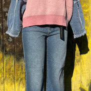 Light blue frayed denim sleeve sweater by ADORA LA featuring a cozy knit design and distressed denim accents.